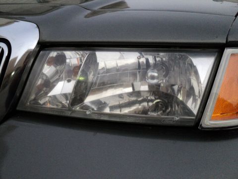2001 Mercury Grand Marquis - The front passenger side headlight assembly of a 2001 Mercury Grand Marquis is shown.