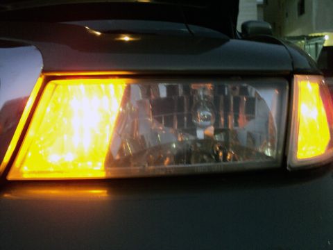 2001 Mercury Grand Marquis - Close-up of the front headlight and amber turn signal assembly on a 2001 Mercury Grand Marquis.