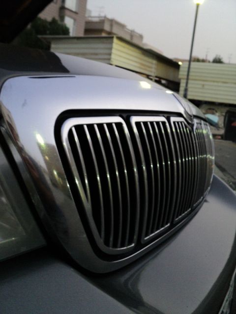 2001 Mercury Grand Marquis - Close-up of the distinctive chrome grille on a 2001 Mercury Grand Marquis.