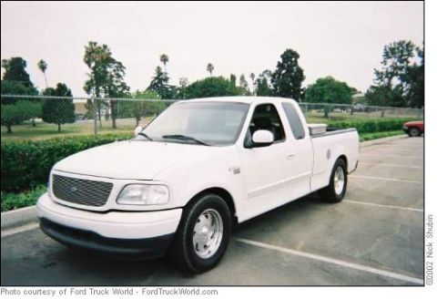 1988 Ford Bronco - This white Ford F-150 pickup truck appears to be from the 1997-2003 generation.