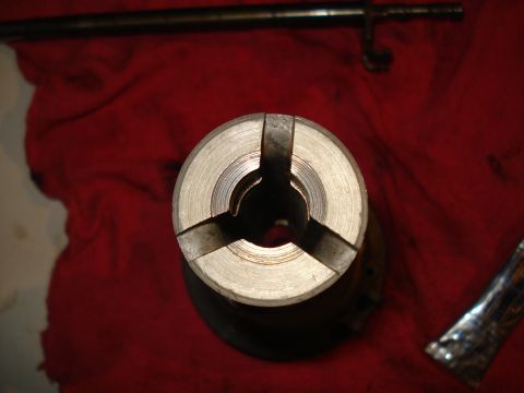 1967 Ford F-250 - A distributor cap, likely for an older vehicle, is shown with its internal mechanism visible.