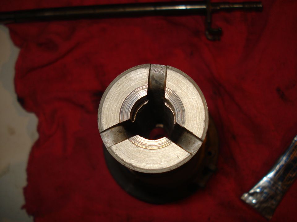 Close-up of a distributor cap with three internal slots
