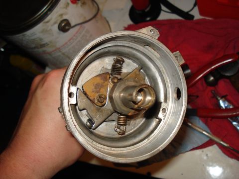 1967 Ford F-250 - Close-up of a vehicle's distributor cap interior, showing internal mechanical components.