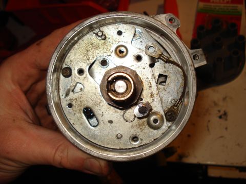 1967 Ford F-250 - Close-up of a distributor part, showing internal components and 'MADE IN USA' inscription.