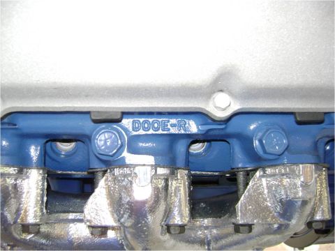 1972 Ford Ranchero - This close-up shows the "DOOE-R" casting mark on a blue engine component, with chrome exhaust manifolds visible.