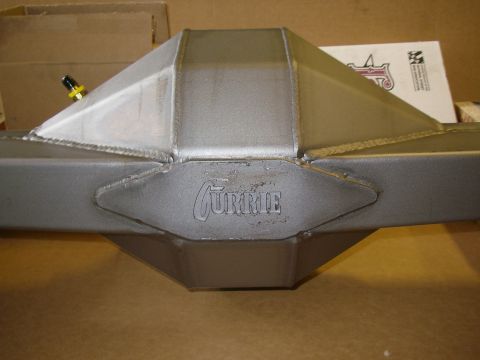 1990 Ford Bronco - New bare-metal Currie fabricated 9-inch rear axle housing photographed from the rear, showing the raised CURRIE script on the third-member…