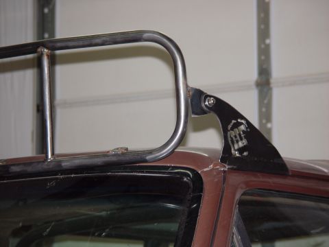 1993 Ford Bronco - Custom roof rack mount fabricated from metal tubing and a decorative bracket.