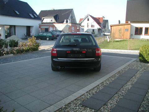 2003 Audi A6 - Rear view of a black 2003 Audi A6 wagon parked in a driveway.