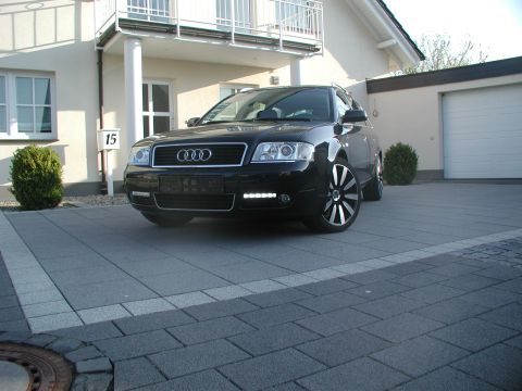 2003 Audi A6 - A black 2003 Audi A6 Avant is parked in a driveway in front of a house.