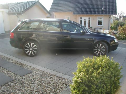 2003 Audi A6 - This black 2003 Audi A6 station wagon is parked in a driveway.