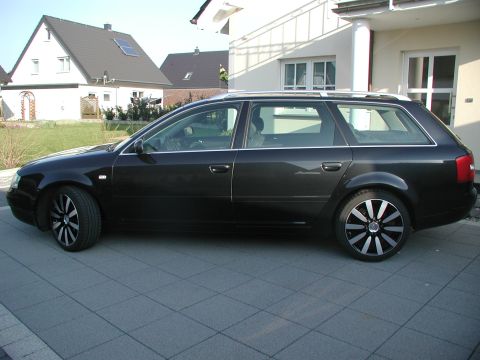 2003 Audi A6 - Black 2003 Audi A6 wagon parked in front of a modern house.