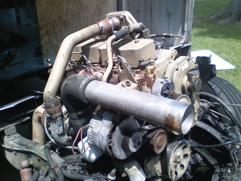 1990 Ford Bronco - Close-up of a diesel engine, showing the turbocharger and associated plumbing.