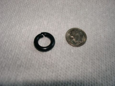 2003 Ford Crown Victoria - A black o-ring is shown next to a dime for scale.