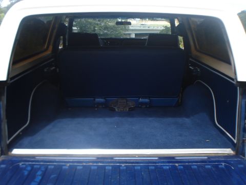 1979 Ford Bronco - The spacious cargo area of a 1979 Ford Bronco, blue carpeting and upholstery.