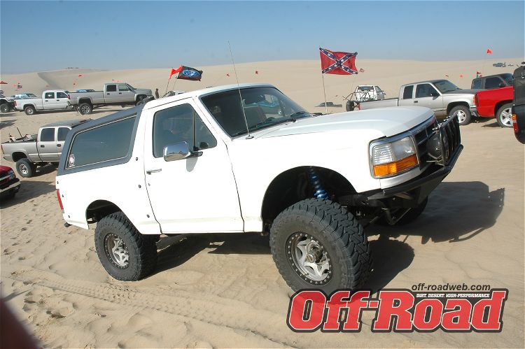 White 1992 Ford Bronco with off-road tires and bumper