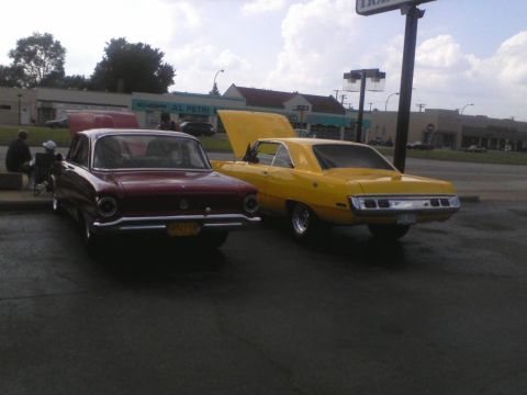 1960 Ford Falcon - Two classic cars, a Ford Falcon and a Dodge Dart, are parked with their hoods open.