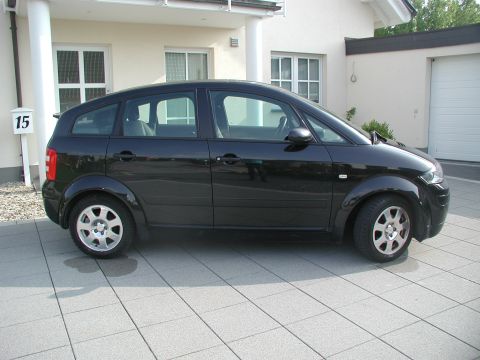 2001 Audi A4 - This black 2001 Audi A4 hatchback is shown from the side, parked in a driveway.