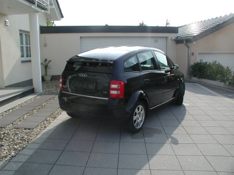 2001 Audi A4 - Rear view of a black Audi A2 parked on a paved driveway.