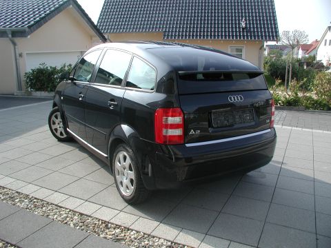 2001 Audi A4 - Rear view of a black Audi A2 hatchback parked on a tiled driveway.