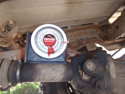 1994 Ford Bronco - A Craftsman protractor is used to measure the angle of a vehicle's driveshaft u-joint.
