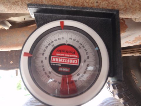 1994 Ford Bronco - A Craftsman magnetic protractor is shown attached to the undercarriage of a vehicle, likely for suspension adjustments.