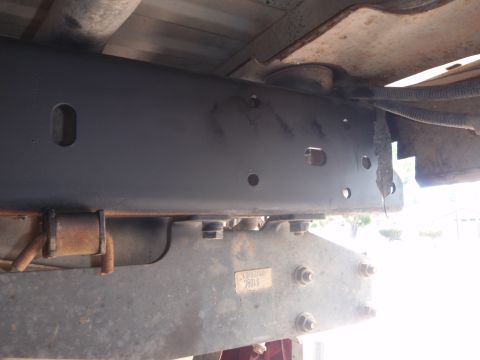1994 Ford Bronco - Close-up view of the undercarriage frame and suspension components, showing a part number label with the digits '26019'.