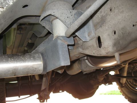 1994 Ford Bronco - This photo shows the undercarriage of a vehicle, including the frame, exhaust, and rear axle components.