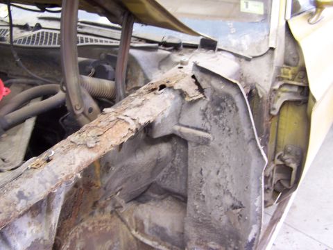 1972 Ford Mustang - The inner fender structure shows significant rust damage, obscuring vehicle identification.