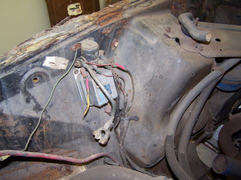 1972 Ford Mustang - This photo shows the electrical components and wiring in a heavily rusted engine bay.