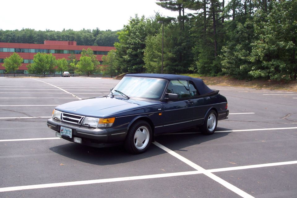 Dark blue 1992 Saab 900 Turbo Convertible parked in an empty lot