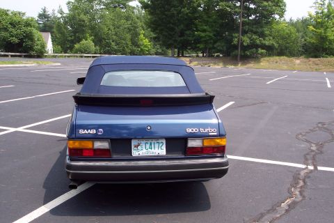 2001 Ford Crown Victoria - Rear view of a blue Saab 900 Turbo convertible in a parking lot.