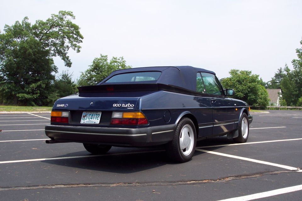 Dark blue Saab 900 Turbo convertible parked in a lot, rear view