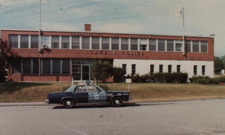 2001 Ford Crown Victoria - A police car sits outside a Massachusetts State Police barracks.