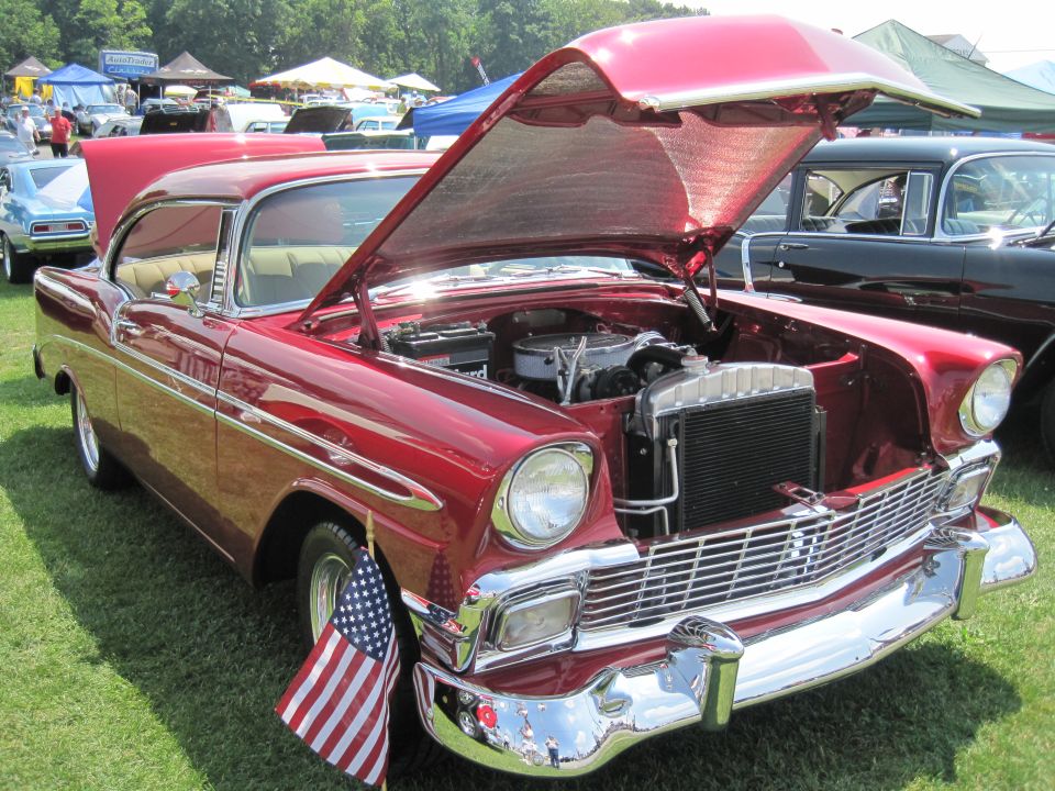 Red 1956 Chevrolet Bel Air with hood open, front view
