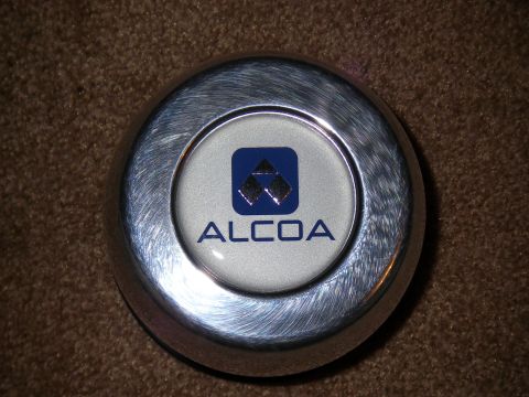 1990 Ford Bronco - Close-up of an Alcoa wheel center cap with its distinctive blue logo.