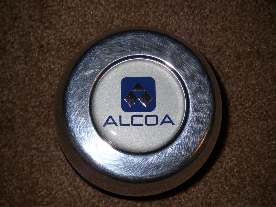 Alcoa wheel center cap with blue logo