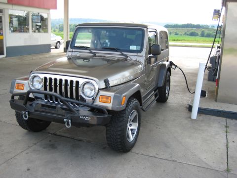 2005 Jeep Wrangler - This Jeep Wrangler Rubicon is seen at a gas station, with the fuel nozzle connected.