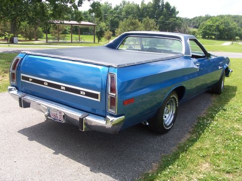 1973 Ford Ranchero - The rear of a blue Ford Ranchero pickup truck is shown with a tonneau cover over the bed.