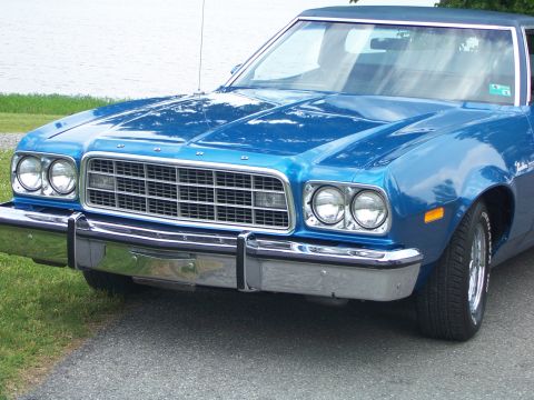 1973 Ford Ranchero - Front view of a blue 1973 Ford Ranchero with a chrome bumper and distinctive grille.