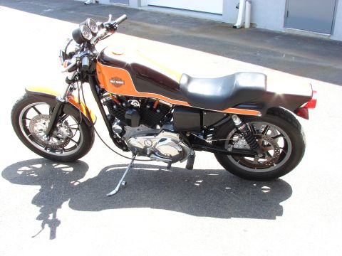 1993 Jeep YJ - This Harley-Davidson motorcycle features a two-tone orange and brown paint scheme on its fuel tank and fenders.
