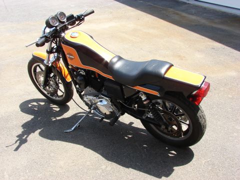 1993 Jeep YJ - This motorcycle features a two-tone orange and brown paint scheme with a black seat and chrome accents.
