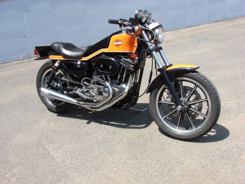 1993 Jeep YJ - This Harley-Davidson Sportster features a two-tone orange and black paint scheme with chrome accents.