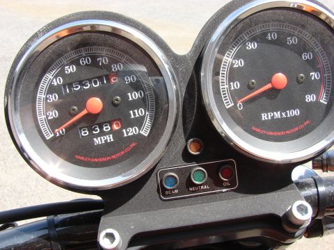1993 Jeep YJ - Close-up of a motorcycle's instrument cluster, displaying speed, RPM, and warning lights.