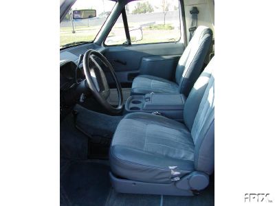 1990 Ford Bronco - Photo originally from seller... Small tears in driver's seat. Otherwise, interior is clean.