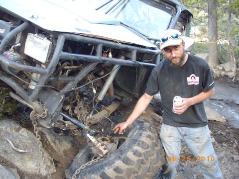 1982 Toyota 4Runner - Man and his heavily modified off-road vehicle are stuck on rocks during an outing.