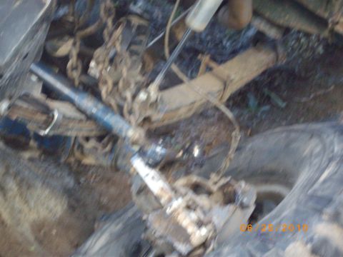 1982 Toyota 4Runner - The photo shows a close-up view of a vehicle's suspension components and some chains.