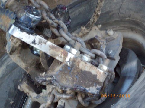 1982 Toyota 4Runner - Detail of a vehicle's suspension system, showing chains and mechanical components.