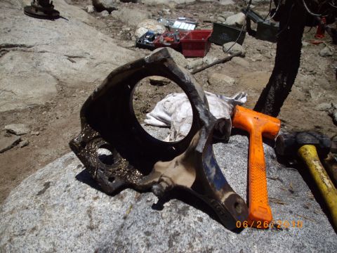 1982 Toyota 4Runner - A disassembled vehicle part rests on a rock, surrounded by tools, with a date stamp of 06/26/2010 visible.