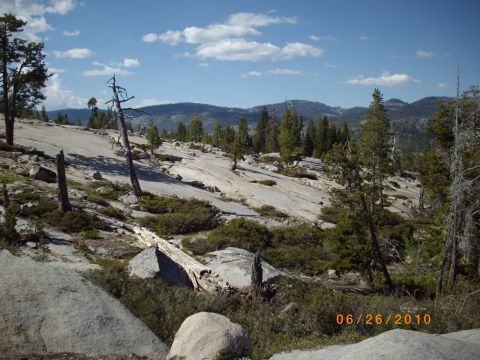 1982 Toyota Pickup/SR5 - A scenic view of a rocky terrain with scattered trees under a partly cloudy sky, dated 06/26/2010.