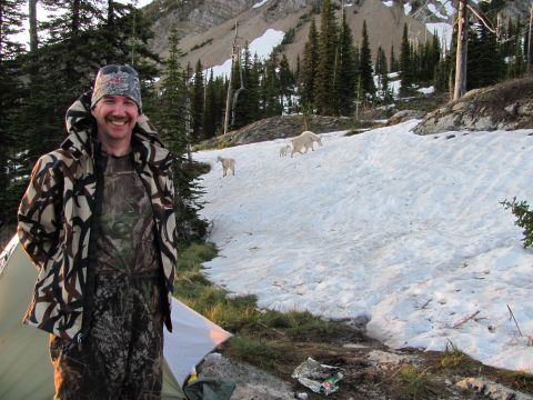 1974 Ford Ranchero - A hunter poses for a photo in a mountainous, snowy landscape with mountain goats visible in the background.